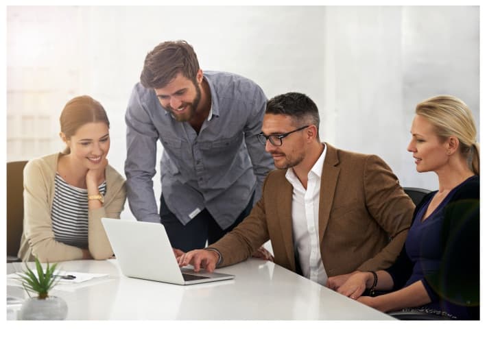 NovaDev engineers pairing at a workstation